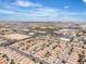 Overhead capture of a suburban development, noting the inclusion of a hospital, highway, and other amenities at 9541 Vast Valley Ave, Las Vegas, NV 89148