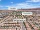 Aerial view of a well-planned neighborhood with community amenities like schools and a waterpark nearby at 9541 Vast Valley Ave, Las Vegas, NV 89148