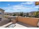 Balcony showcasing outdoor seating and neighborhood views with a blue sky background at 9541 Vast Valley Ave, Las Vegas, NV 89148