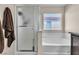 Bathroom with a soaking tub, walk-in shower, and neutral wall paint at 9541 Vast Valley Ave, Las Vegas, NV 89148