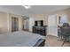 Cozy bedroom features a comfortable bed, dresser, TV, and chair at 9541 Vast Valley Ave, Las Vegas, NV 89148