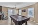 Game room with tile floors, a billiards table, and a sliding door to the outside at 9541 Vast Valley Ave, Las Vegas, NV 89148
