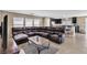 Spacious living room features a large sectional sofa and an open layout to the kitchen at 9541 Vast Valley Ave, Las Vegas, NV 89148