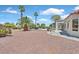 Backyard with mature palm trees and desert landscaping at 9552 Gold Bank Dr, Las Vegas, NV 89134