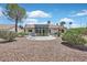 Home exterior with a patio featuring outdoor seating and desert landscaping at 9552 Gold Bank Dr, Las Vegas, NV 89134