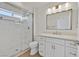 Modern bathroom featuring glass enclosed shower, white vanity with quartz countertop, and chrome fixtures at 9552 Gold Bank Dr, Las Vegas, NV 89134