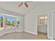 Bright primary bedroom with bay window, fan, and ensuite bathroom access at 9552 Gold Bank Dr, Las Vegas, NV 89134