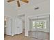 Large bedroom with natural light, fan, vaulted ceilings, mirrored closet, and neutral color palette at 9552 Gold Bank Dr, Las Vegas, NV 89134