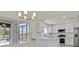 Modern kitchen with white cabinets, stainless steel appliances, and ample counter space with an eat-in area at 9552 Gold Bank Dr, Las Vegas, NV 89134
