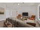 Inviting living room featuring neutral walls, vaulted ceilings, and modern decor at 9552 Gold Bank Dr, Las Vegas, NV 89134