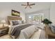 Comfortable bedroom with bay windows, a ceiling fan, and a well-decorated interior at 9552 Gold Bank Dr, Las Vegas, NV 89134