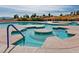 Community hot tub surrounded by lush greenery and views of the neighborhood at 9552 Gold Bank Dr, Las Vegas, NV 89134