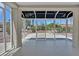 Sunroom with tiled floor and expansive windows offering beautiful backyard views at 9552 Gold Bank Dr, Las Vegas, NV 89134
