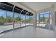 Bright sunroom features tile flooring and panoramic views of the lush backyard at 9552 Gold Bank Dr, Las Vegas, NV 89134