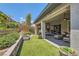 Lush backyard featuring a tranquil water feature, vibrant plants, and a comfortable outdoor living area at , Henderson, NV 89011