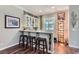 Chic bar area with custom cabinetry, granite countertops, and comfortable seating at , Henderson, NV 89011