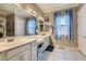 Bathroom featuring dual sinks, modern fixtures, framed art, and clean design at , Henderson, NV 89011