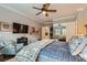 Bedroom view showing sitting chairs, ceiling fan, natural light, and ensuite access at , Henderson, NV 89011