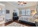 Bedroom with hardwood floors, ceiling fan, tv, and ensuite bathroom access at , Henderson, NV 89011