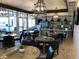 Cafe area features multiple tables and chairs with pendant lighting, and a serving area at , Henderson, NV 89011
