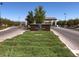 View of the community entrance sign on a sunny day with well-maintained landscaping and a brick-paved road at , Henderson, NV 89011