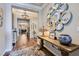 Elegant foyer with hardwood floors, decorative mirrors, and stylish console table at , Henderson, NV 89011