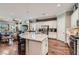Open kitchen view featuring stainless steel appliances, granite counters, and breakfast bar seating at , Henderson, NV 89011