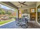 Relaxing covered patio with a ceiling fan, an outdoor fireplace, seating, and garden views at , Henderson, NV 89011