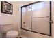 Bathroom view showing the toilet and tub with a framed art piece on the wall at , Las Vegas, NV 89131