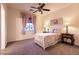 Bedroom with a ceiling fan, and neutral colored walls, decor, and curtains at , Las Vegas, NV 89131