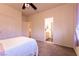 Bedroom featuring neutral walls and carpet with an open bathroom doorway at , Las Vegas, NV 89131