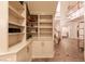 Spacious foyer with custom built-in shelving and tile floors, adjacent to the staircase and hallways at , Las Vegas, NV 89131
