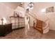 Elegant foyer featuring a curved staircase, decorative tile inlay, and stylish furnishings at , Las Vegas, NV 89131