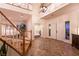 Grand foyer with staircase, decorative tile flooring, and natural light creates a welcoming entrance at , Las Vegas, NV 89131