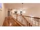 Hallway with beautiful hardwood floors and white banister with railing on the second floor at , Las Vegas, NV 89131