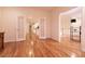 Open hallway with hardwood floors, white trim and access to other rooms in the home at , Las Vegas, NV 89131