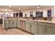 Modern kitchen featuring stylish green cabinetry, granite countertops and stainless steel appliances at , Las Vegas, NV 89131