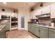 An elegant kitchen equipped with modern appliances, granite countertops and a walk-in pantry at , Las Vegas, NV 89131