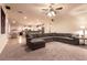 Open-concept living room with a large sectional sofa, flowing into the kitchen area at , Las Vegas, NV 89131