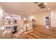 Second-floor loft area featuring hardwood floors, balcony with railings, and great natural light at , Las Vegas, NV 89131