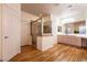 Bathroom with tiled shower, wood floors, and separated vanities at , Las Vegas, NV 89131