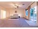 Bright main bedroom with neutral carpet, ceiling fan, and access to a private balcony at , Las Vegas, NV 89131
