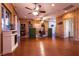 A spacious office space with wood paneling, a ceiling fan, and lots of natural light at , Las Vegas, NV 89131