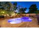 Backyard pool featuring a stone waterfall and desert landscaping at , Las Vegas, NV 89131