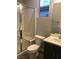 Modern bathroom featuring a glass-enclosed shower and vanity with dark wood cabinets at 1027 Cambridge Park St, Las Vegas, NV 89148