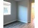 Neutral bedroom with natural light, laminate flooring, and white trim at 1027 Cambridge Park St, Las Vegas, NV 89148