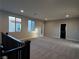 Spacious upstairs hallway with carpet flooring and natural light at 1027 Cambridge Park St, Las Vegas, NV 89148