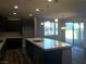 Modern kitchen features a large island with quartz countertop and stainless steel appliances at 1027 Cambridge Park St, Las Vegas, NV 89148