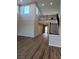 Spacious living room with wood-look flooring, high ceilings, and a view of the upper-level railing at 1027 Cambridge Park St, Las Vegas, NV 89148