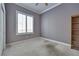Neutral bedroom with carpet, closet, window with shutters, and view at 10513 Longwood Dr, Las Vegas, NV 89134